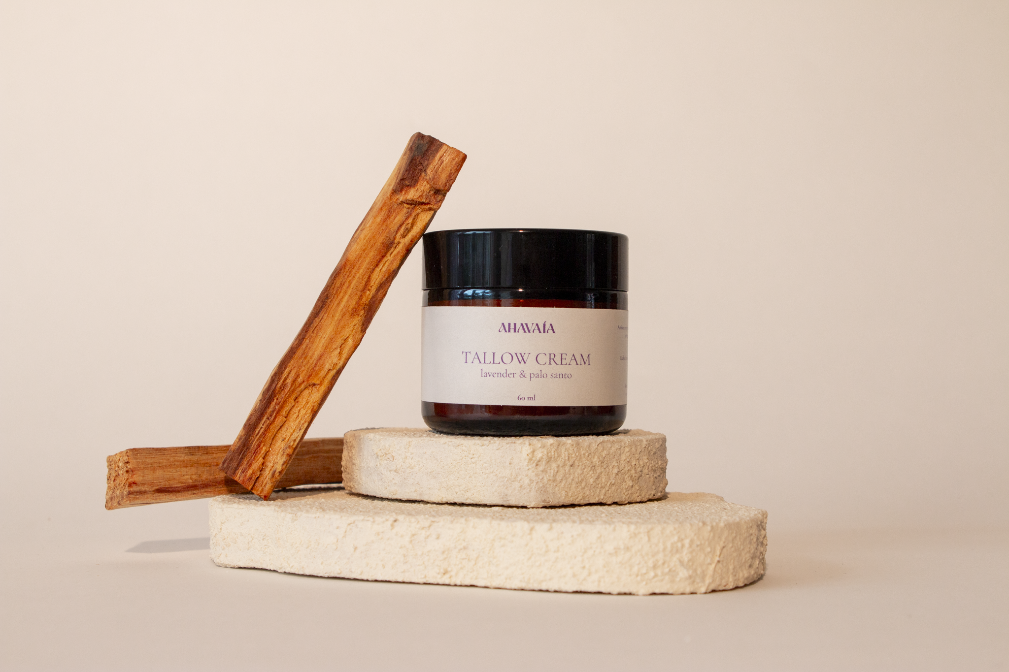 VAÍAA Tallow Cream Lavender & Palo Santo on display with wood